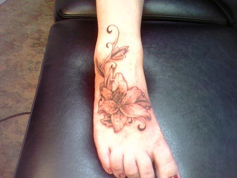 Large flower foot tattoo 