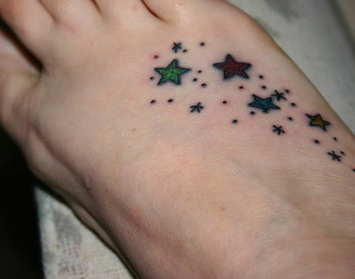 Small stars foot tattoo.