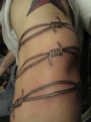 Here we have a picture gallery of excellent barbed wire tattoos.