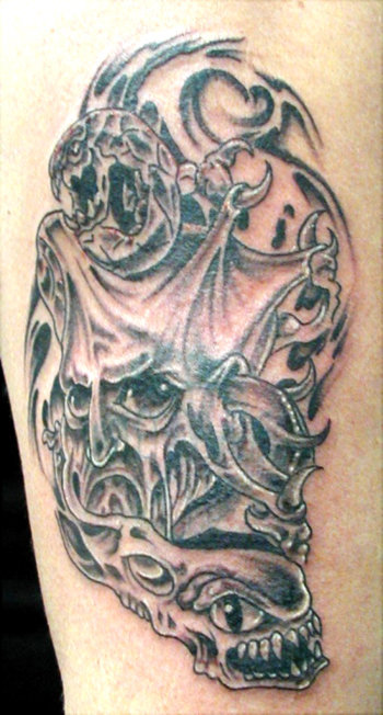 big skull tattoo at back body. Demon Tattoos