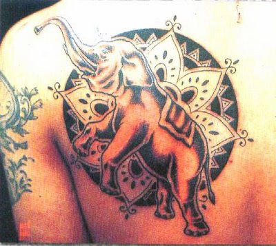 Elephant tattoos look outstanding with other large African animals such as 