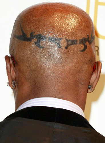  Jamie Foxx, as he sports a fake tribal crown tattoo on his head, 