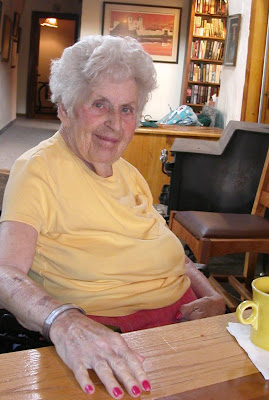 Mom at the dining room table in Kate and Gary's house