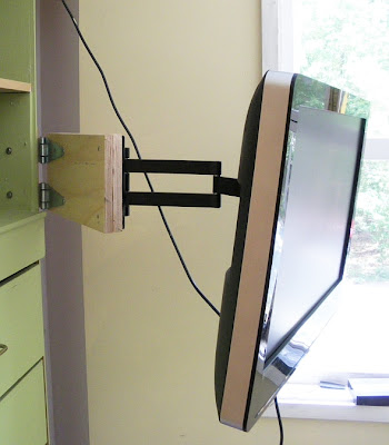home-made extension arm to add to a purchased tv swivel arm