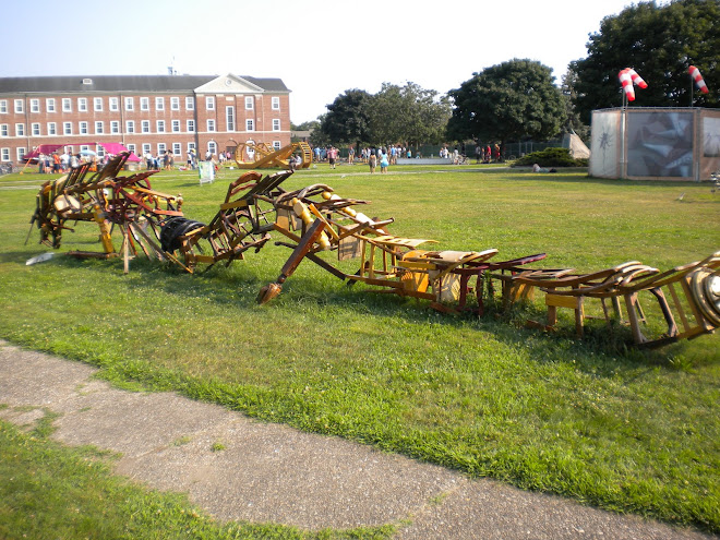 Dragon made out of wooden chairs and legs