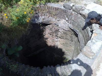 A Triangular Well with Round Mouth.