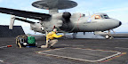An E-2D Advanced Hawkeye makes its first carrier takeoff Feb. 1 from the aircraft carrier Harry S. Truman. The new aircraft is being tested over a six-day period. E-2D Advanced Hawkeye