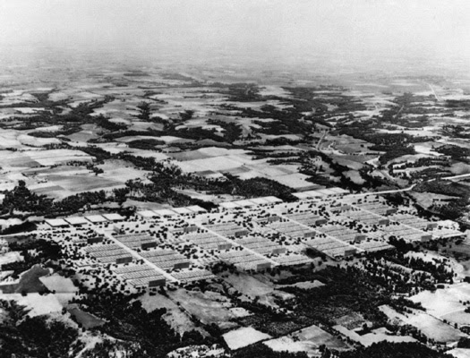 Explain why many areas with good transport networks are densely populated image