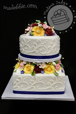 spring flowers cake daisies roses calla lilies buttercream