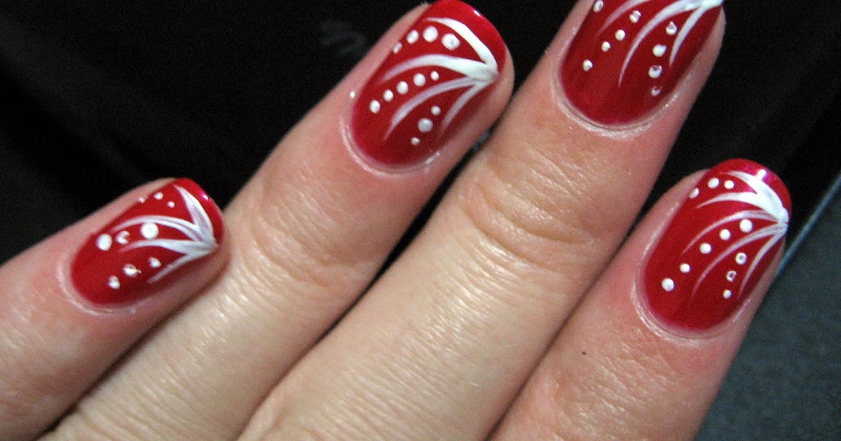 Homemade nails: Red nails with white lines and dots