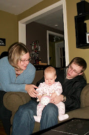 Here I am with my baby dolly and here are my Mommy and Daddy with their baby - ME!