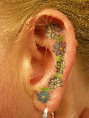 Skull Tattoo in Ear Skull Tattoo in Ear Flower Tattoo in Ear