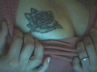 girl+with+breast+flower+tattoos.jpg