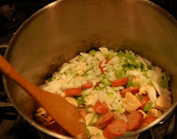 Adding veggies to Jambalaya