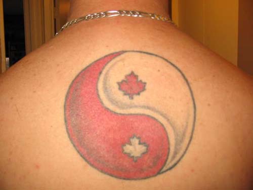 yin and yang tattoos. ying yang tattoos on back body