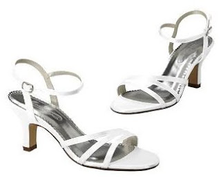 Simple white strappy shoe with a reasonable heel.