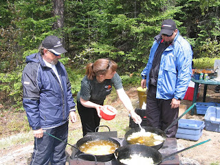 Fish'n Canada Hosts Angelo Viola and Mike Miller eating fishing shore lunch