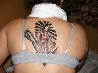 Design on Lower Back Girl tattoo on back girl. Design on Lower Back Girl