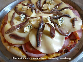 Pizza with anchovies and blue cheese.