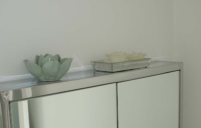 Lotus flower tealight holder and bevelled mirrored tray Lotus flower tealight holder from Lavender Room and bevelled mirrored tray from Marks and Spencer