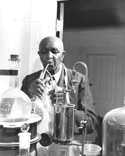 George Carver working in his lab inventing new things. title=