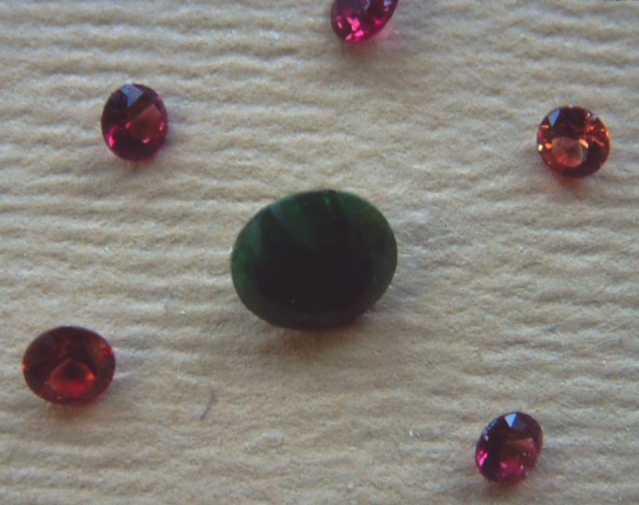 [Gemstones9-CutPyropes&ChromeDiopside.jpg]