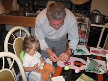 George helping Gabriella decorate eggs