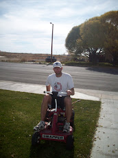 Chris loves the old riding lawn Mower.  That is my Man!! I love him!!!