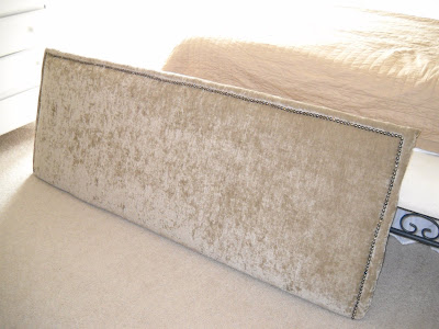 here's my DIY upholstered headboard complete with nail head trim