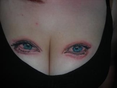 Cool Eyes with Breast Tattoo Picture is a cool tattoo on the breast with a