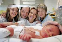 HAPPY additions ... daughter Erika, Eric and Francoise Pernoud, and son Axell, with one of the triplets, Sebastian. Mrs Pernoud had lost hope of having more children.