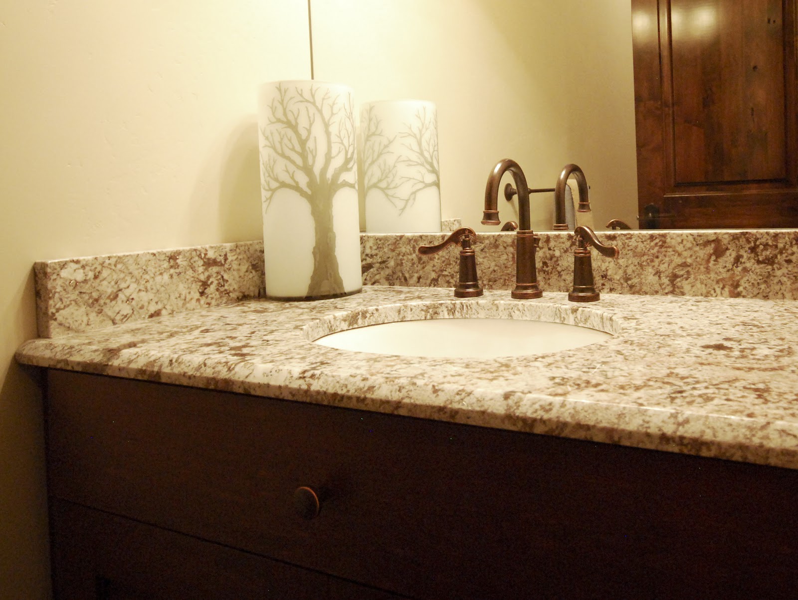 The Granite Gurus Rain Forest Brown marble & Delicatus granite vanities