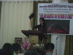 My daughter, Heavenly Love Duenas lifts up the Bible as she sings