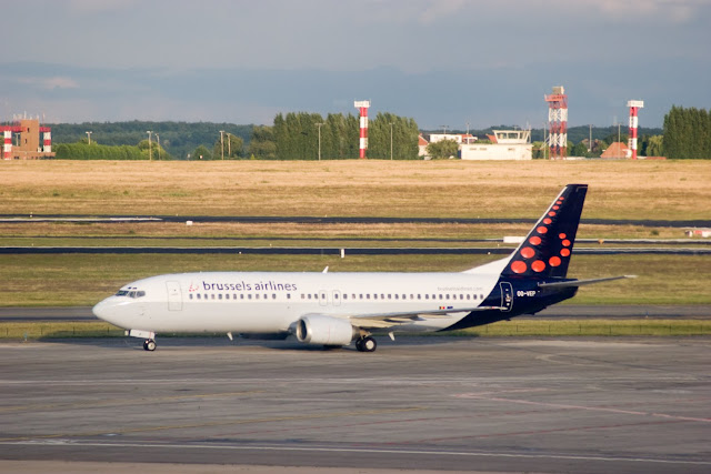 a white airplane on a runway