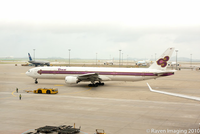 a large white airplane on a runway