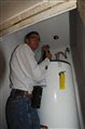 Bobby White works on the plumbing
