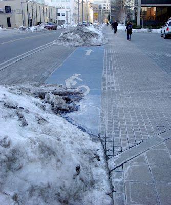 snow dumped in Cambridge bike lanes
