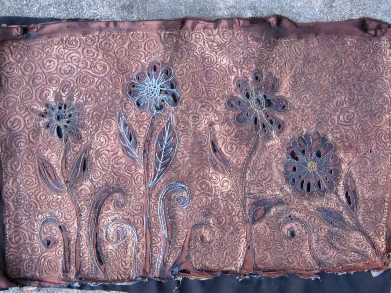 Eiloren Burning a Quilt Textile art with a Heat Gun and Synthetic