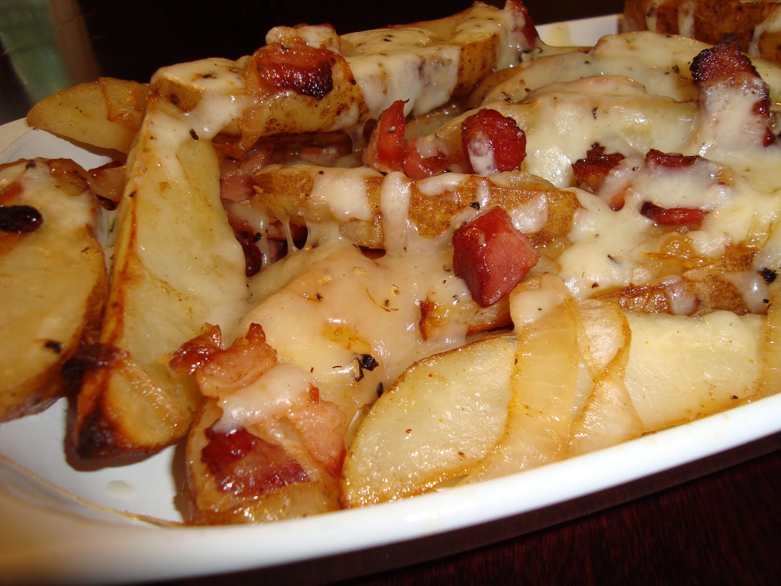 A Little Cooking Potato Wedges with Bacon, Onions, and Smoked Cheddar