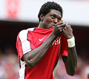 Arsenal 3 - 1 Shrewsbury Town: Comfortable win after first half scare Adebayor+badge+kissing