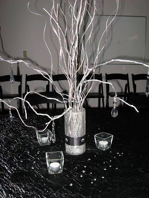 one of the many bistro table centerpiecessilver curly willow hung with 
