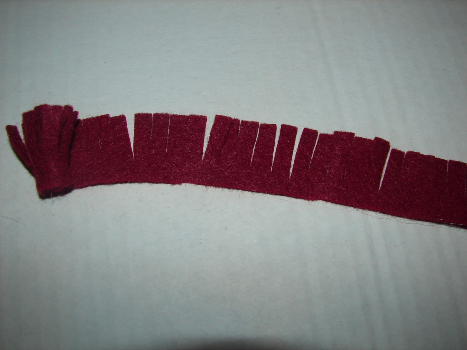 A girl and a glue gun felt flowers.