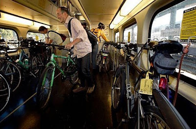 Image of bicyclists crowding onto Caltrain car
