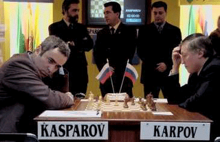 FIDE presidential candidate and former World Chess Champion, Anatoly Karpov,  second left, former World Chess Champion, Garry Kasparov, right, President  of English Chess Federation, CJ de Mooi, second right, and British Chess