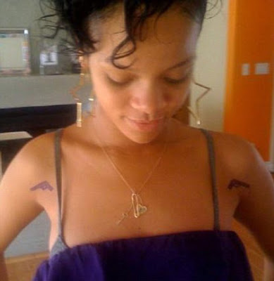 rihanna tattoos gun. Shows Off New Gun Tattoo