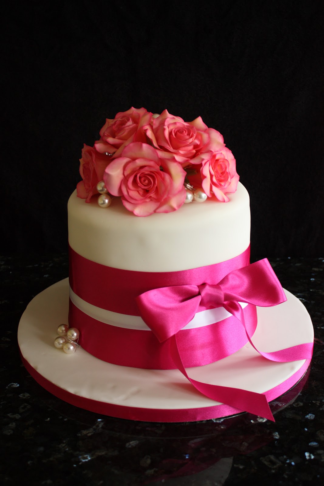 Vanilla 84th birthday cake with pink sugar roses