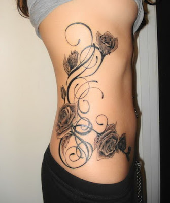 Simple butterfly or angle tattoos also look great on rib cage.
