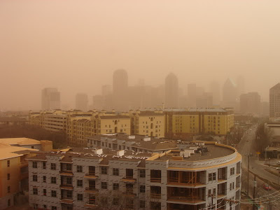 Houston buildings obscured by brownish smog