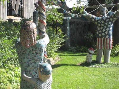 Mosaic man and woman holding either end of a clothesline