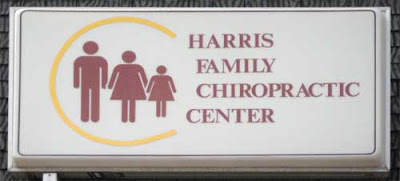 Harris Family Chiropractic Center with three restroom-style people, dad, mom and daughter